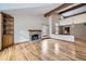 Living room with hardwood floors, fireplace, and vaulted ceiling at 223 Durham Ct, Castle Pines, CO 80108