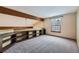 Spacious loft area with built-in shelving and window at 223 Durham Ct, Castle Pines, CO 80108