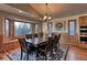 Elegant dining room with a large table and bay window at 10197 Crest View Dr, Morrison, CO 80465