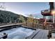 Outdoor hot tub on a wooden deck, perfect for relaxation while enjoying the scenic mountain views at 10197 Crest View Dr, Morrison, CO 80465