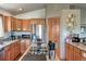 Modern kitchen featuring wood cabinets and an island cooktop at 10197 Crest View Dr, Morrison, CO 80465