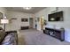 Spacious living room features a comfortable leather sofa and large television, great for entertaining at 10197 Crest View Dr, Morrison, CO 80465
