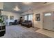 Living room with neutral carpet, a leather sofa and an electric fireplace at 10197 Crest View Dr, Morrison, CO 80465
