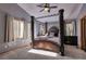 Luxurious bedroom featuring a four-poster bed and large windows at 10197 Crest View Dr, Morrison, CO 80465