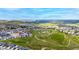 Expansive aerial view showing the neighborhood, surrounding green space, and mountain views in the distance at 2060 Peralta Loop, Castle Rock, CO 80104