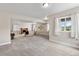 This finished basement offers a large recreational area with neutral carpet, a TV, and ample natural light at 2060 Peralta Loop, Castle Rock, CO 80104