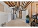 Unfinished basement with painted walls, exposed pipes, concrete floor, and a water heater at 2060 Peralta Loop, Castle Rock, CO 80104
