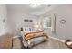 Comfortable bedroom featuring neutral paint, carpet, a bright window, and homey decor at 2060 Peralta Loop, Castle Rock, CO 80104