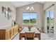 Dining room with vaulted ceiling, large window offering neighborhood views, and stylish decor at 2060 Peralta Loop, Castle Rock, CO 80104