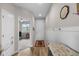 Inviting entryway with wainscoting, wood floors, and views into an adjacent room with lots of natural light at 2060 Peralta Loop, Castle Rock, CO 80104