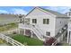 Rear exterior featuring a spacious yard with artificial turf and a large deck with a view at 2060 Peralta Loop, Castle Rock, CO 80104