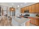 Well-equipped kitchen with stainless steel appliances, granite counters, and a central island with a sink at 2060 Peralta Loop, Castle Rock, CO 80104