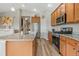 Bright kitchen features stainless steel appliances, granite countertops, and wood-look flooring at 2060 Peralta Loop, Castle Rock, CO 80104
