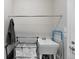 Functional laundry room with a utility sink and storage, offering convenience for laundry tasks at 2060 Peralta Loop, Castle Rock, CO 80104
