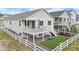 Charming home featuring a spacious deck, white picket fence, and low maintenance landscaping at 2060 Peralta Loop, Castle Rock, CO 80104