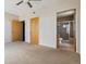 Spacious bedroom with carpet flooring and private bathroom at 2900 W 44Th Ave # 301, Denver, CO 80211