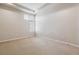 Empty bedroom with neutral carpet, white walls and tray ceiling offers a calming and flexible space at 2900 W 44Th Ave # 301, Denver, CO 80211
