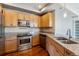 Kitchen features granite countertops and stainless steel appliances at 2900 W 44Th Ave # 301, Denver, CO 80211