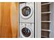 A stacked washer and dryer set-up, next to built in storage, provides the homeowner with laundry convenience at 2900 W 44Th Ave # 301, Denver, CO 80211