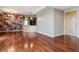 Open living room featuring hardwood floors and access to the kitchen at 2900 W 44Th Ave # 301, Denver, CO 80211