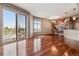 Open living room featuring hardwood floors and access to balcony at 2900 W 44Th Ave # 301, Denver, CO 80211