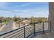City street view from the balcony with metal railings provides a glimpse of the neighborhood at 2900 W 44Th Ave # 301, Denver, CO 80211