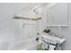 Clean bathroom with a classic white pedestal sink and a shower/tub combo at 3500 S Franklin St, Englewood, CO 80113