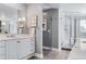 Bathroom featuring a modern glass enclosed shower, marble vanity, and recessed lighting at 3500 S Franklin St, Englewood, CO 80113