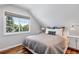Serene bedroom with a queen-size bed and large window offering plenty of natural light at 3500 S Franklin St, Englewood, CO 80113