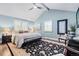 A serene primary bedroom with vaulted ceilings, elegant decor, and ample natural light through shuttered windows at 3500 S Franklin St, Englewood, CO 80113
