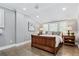 Cozy bedroom with a wood bed frame, hardwood floors, and shutters on the windows at 3500 S Franklin St, Englewood, CO 80113