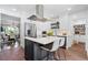 Modern kitchen featuring white cabinets, stainless steel appliances, and a stylish island at 3500 S Franklin St, Englewood, CO 80113
