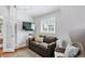 Cozy living room with comfortable sofa and a large smart TV at 3500 S Franklin St, Englewood, CO 80113