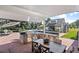 A stunning outdoor kitchen with stone counters, stainless steel appliances and an inviting patio area for entertaining at 3500 S Franklin St, Englewood, CO 80113