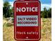 Notice sign indicating that the property is under 24/7 video surveillance at 3500 S Franklin St, Englewood, CO 80113