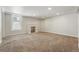 Large finished basement with carpet, recessed lighting, and a brick fireplace, ideal for entertainment or relaxation at 3345 W Clyde Pl, Denver, CO 80211