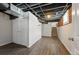 Basement room featuring durable wood-look floors and closet at 3345 W Clyde Pl, Denver, CO 80211