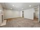 Spacious basement with neutral carpet, fireplace, recessed lighting, and closet for flexible living space at 3345 W Clyde Pl, Denver, CO 80211