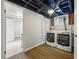 Convenient laundry room with modern front-load washer and dryer at 3345 W Clyde Pl, Denver, CO 80211
