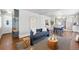 Spacious living room with hardwood floors and an open view to the kitchen at 3345 W Clyde Pl, Denver, CO 80211