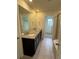 Bathroom featuring a double vanity with granite countertops and a large mirror at 10611 Casper St, Parker, CO 80134