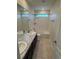 Well-lit bathroom with a double vanity, granite countertops, and a shower/tub combo at 10611 Casper St, Parker, CO 80134