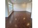 Bright and airy living room with hardwood floors and large windows, offering ample natural light at 10611 Casper St, Parker, CO 80134