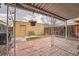 Charming brick patio with covered seating area perfect for outdoor relaxation and entertainment at 12407 E Louisiana Ave, Aurora, CO 80012