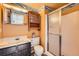 Bathroom featuring vanity sink and shower stall at 12407 E Louisiana Ave, Aurora, CO 80012