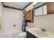 Cozy bathroom with a tub, shower, vanity, and ample storage space for toiletries at 12407 E Louisiana Ave, Aurora, CO 80012