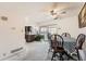 Eat-in dining area featuring a ceiling fan and sliding glass doors to the backyard at 12407 E Louisiana Ave, Aurora, CO 80012