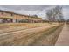 Residential street featuring well-maintained townhomes with mature trees and a pleasant neighborhood atmosphere at 12407 E Louisiana Ave, Aurora, CO 80012