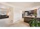 Functional kitchen adjacent to living area with stainless appliances and breakfast bar for casual dining at 12407 E Louisiana Ave, Aurora, CO 80012