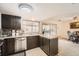 Traditional kitchen with stainless steel dishwasher and breakfast nook at 12407 E Louisiana Ave, Aurora, CO 80012